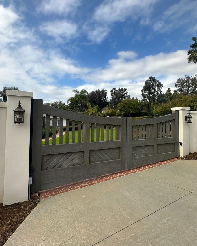 Gray old reclaimed wooden gate with a craftsman like style. 18ft long.